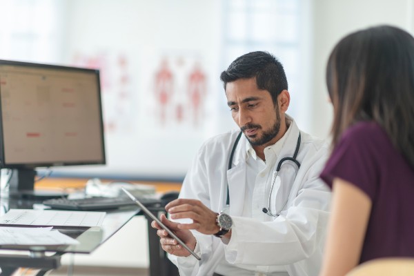image depicting doctor talking to patient